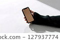 closeup image of a businessman hand holding mobile phone 127937774