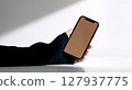 woman using mobile phone in the office 127937775