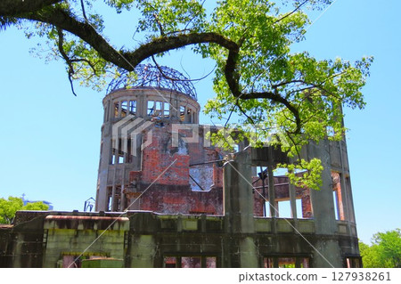 Praying for world peace from Hiroshima Atomic Bomb Dome Praying for world peace from Hiroshima Atomic Bomb Dome 127938261