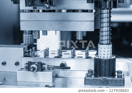 The electrical parts mass production by progressive die in the light blue scene. The electrical parts mass production by progressive die in the light blue scene. 127938683