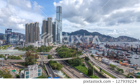 June 29 2025 Panoramic View of Busy Urban Harbor with Skyscrapers 127939224