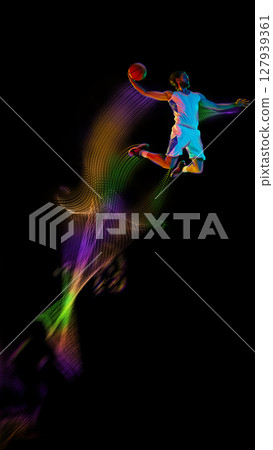 Basketball player dunking with glowing trail, futuristic slam dunk motion art. Poster, flyer Basketball player dunking with glowing trail, futuristic slam dunk motion art. Poster, flyer 127939361