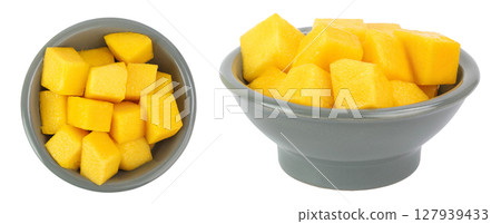 mango diced in ceramic bowl isolated on white background. Top view. Flat lay mango diced in ceramic bowl isolated on white background. Top view. Flat lay 127939433