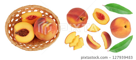 Ripe peach fruit with half in a wicker basket isolated on white background with full depth of field. Top view. Flat lay Ripe peach fruit with half in a wicker basket isolated on white background with full depth of field. Top view. Flat lay 127939483