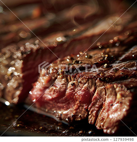 Delicious freshly grilled steak on a plate, hot red meat with juicy meat, freshly grilled steak 127939498