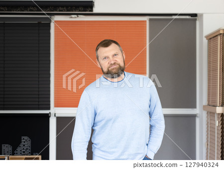 Small Business Owner in Sunshade Systems Showroom Small Business Owner in Sunshade Systems Showroom 127940324