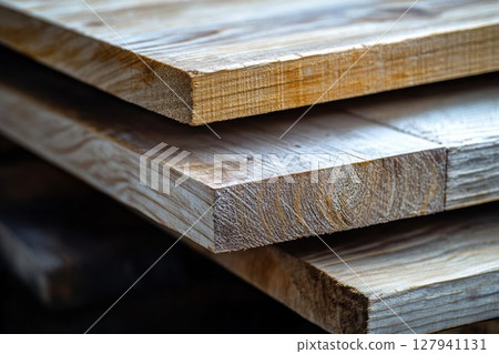 Stacked Wood Planks Showcasing Natural Grain and Texture, Carpentry Materials Stacked Wood Planks Showcasing Natural Grain and Texture, Carpentry Materials 127941131