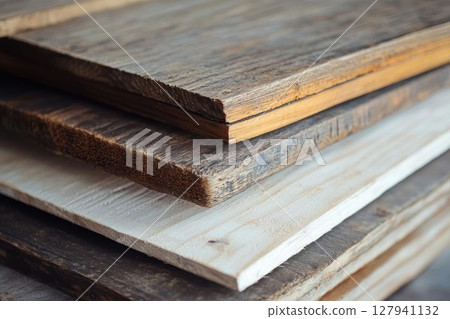 Stack of Wood Planks Showcases Variety of Textures and Grains with Rustic Charm. 127941132