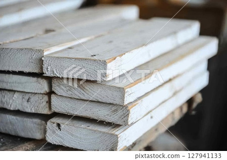 White Wooden Planks Stacked Neatly for Construction Material with Carpentry, Woodworking Projects. 127941133