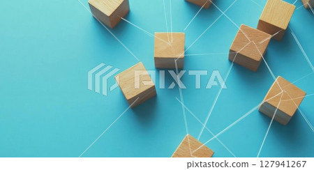 Wooden Blocks Connect with String on Blue Background, Symbolizing Network and Collaboration. 127941267
