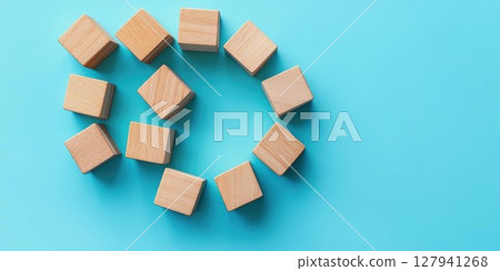 Wooden Blocks Arranged on Blue Background, Minimalist Concept 127941268
