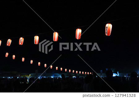 Lanterns hanging from a festival tower 127941328