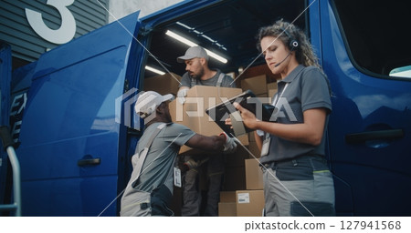 Employees Loading Delivery Truck. Female Manager Using Digital Tablet and Barcode Scanner 127941568