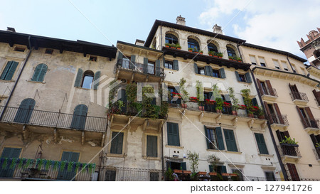 Piazza Delle Erbe square in historical centre Citta Antica, old houses at Verona 127941726