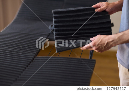 Installation of Acoustic Foam Panels is essential for effective Soundproofing in various settings 127942517