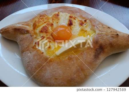 Khachapuri in Adjarian style. Georgian cuisine dish 127942589
