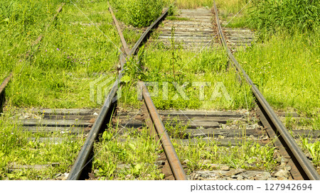electric train tracks on a bright Sunny day 127942694