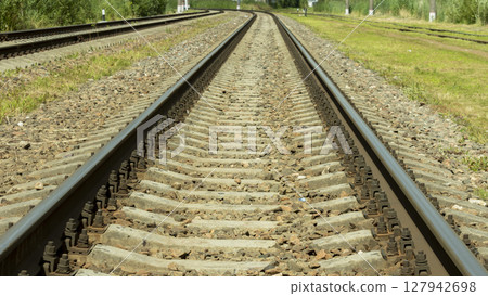 electric train tracks on a bright Sunny day electric train tracks on a bright Sunny day 127942698