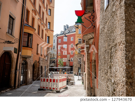 Old European street with colorful buildings and construction barrier in summer Old European street with colorful buildings and construction barrier in summer 127943670