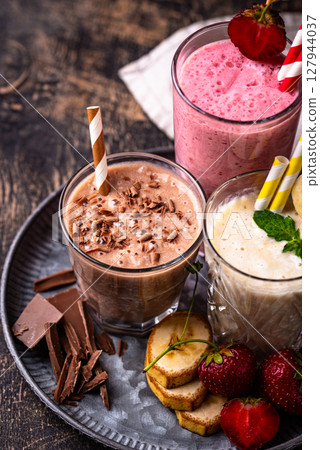Milkshake from strawberry, banana and chocolate 127944037