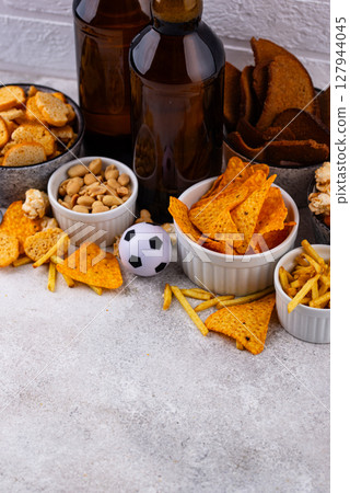 Beer and different snacks for Superbowl or football party 127944045
