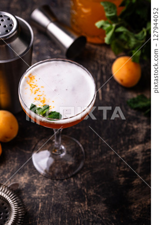 Fresh apricot cocktail martini with mint 127944052