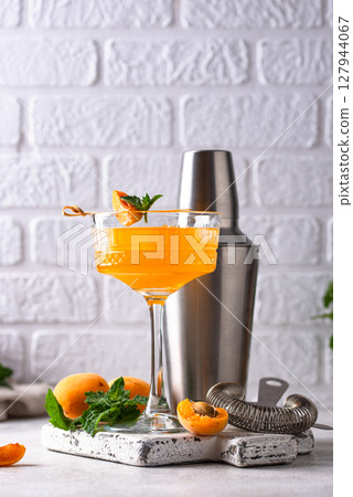 Fresh apricot Bellini cocktail with mint Fresh apricot Bellini cocktail with mint 127944067