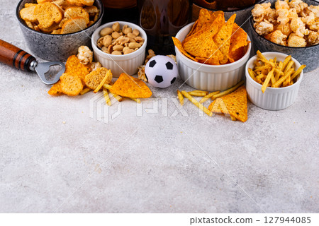Beer and different snacks for Superbowl or football party 127944085
