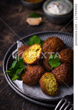 Middle Eastern falafel balls with sauce Middle Eastern falafel balls with sauce 127944092