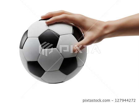 Soccer ball in hand isolated, black and white hexagon pattern, sporty vibe 127944272