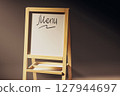 Wooden sign that says Free of Charge is on a wooden stand 127944697