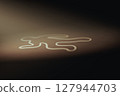 Outline of human's body is drawn on a dark wooden floor background 127944703