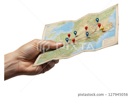 Hand holding folded map with marked route and location pins, isolated on transparent background, travel planning, navigation, adventure journey concept Hand holding folded map with marked route and location pins, isolated on transparent background, travel planning, navigation, adventure journey concept 127945056
