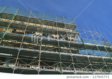 Scaffolding installed at construction site 127945771