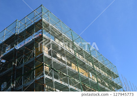Scaffolding installed at construction site 127945773