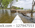 spring kayaking or canoeing on Horsetooth Reservoir at foothills of Rocky Mountains near Fort Collins, Colorado - POV paddler perspective 127947553