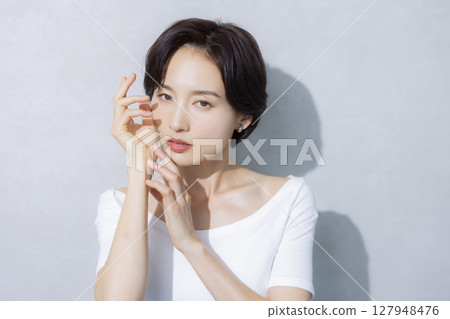 A woman with short hair A woman with short hair 127948476