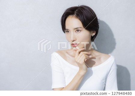 A woman with short hair A woman with short hair 127948480
