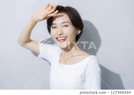 A woman with short hair A woman with short hair 127948484