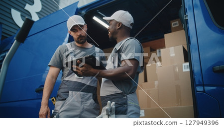 Multiethnic Workers Standing near Delivery Truck Ready for Unloading 127949396