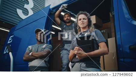 Team of Diverse Workers Standing near Delivery Truck, Looking at Camera Team of Diverse Workers Standing near Delivery Truck, Looking at Camera 127949602