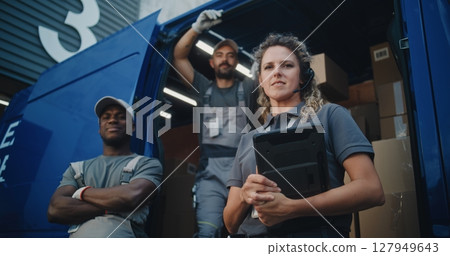 Team of Diverse Workers Standing near Delivery Truck, Looking at Camera Team of Diverse Workers Standing near Delivery Truck, Looking at Camera 127949643