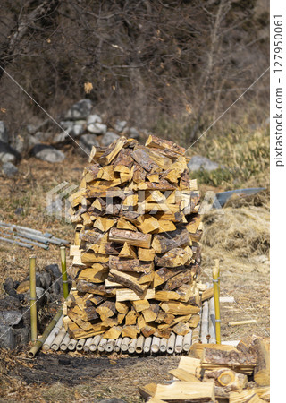 Stacked firewood 127950061