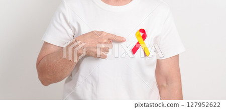 World hepatitis day awareness month, 28 July. elderly woman with Red and Yellow ribbon. Liver cancer, Jaundice, Cirrhosis, Failure, Enlarged, Hepatic Encephalopathy and Health concept World hepatitis day awareness month, 28 July. elderly woman with Red and Yellow ribbon. Liver cancer, Jaundice, Cirrhosis, Failure, Enlarged, Hepatic Encephalopathy and Health concept 127952622