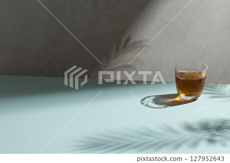 Minimal Aesthetic Beverages in Natural Light with Greenery. 127952643