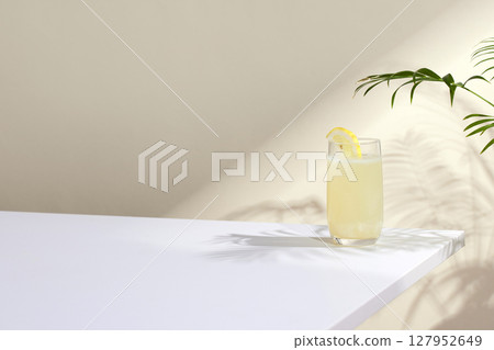 Minimal Aesthetic Beverages in Natural Light with Greenery. 127952649