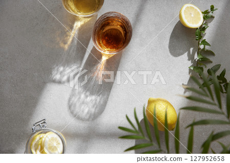 Minimal Aesthetic Beverages in Natural Light with Greenery. Minimal Aesthetic Beverages in Natural Light with Greenery. 127952658