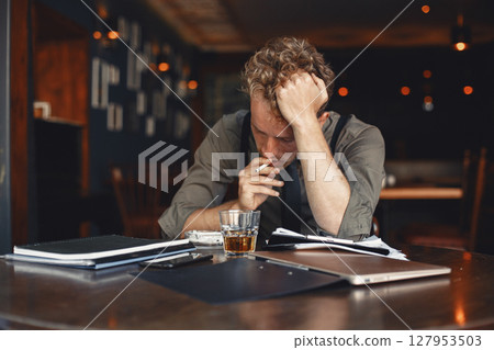 Man drinks whiskey. Businessman reads documents. Director in a shirt and suspenders. Man drinks whiskey. Businessman reads documents. Director in a shirt and suspenders. 127953503