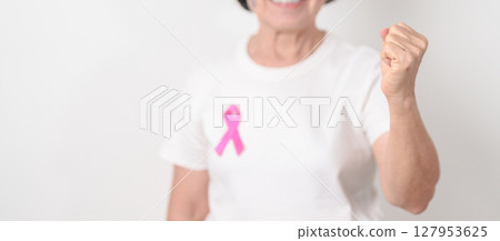 Elderly woman with pink Ribbon for Pink October Breast Cancer Awareness month, May Women Health, August World Breastfeeding week, Nursing Mothers, Pregnancy and Infant Loss Remembrance, Stillbirth 127953625