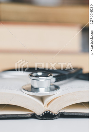Concept business education essential idea globalization, student learn and study in university and colleges to master knowledge needed travel global economy. book stethoscope for medical health care Concept business education essential idea globalization, student learn and study in university and colleges to master knowledge needed travel global economy. book stethoscope for medical health care 127954029